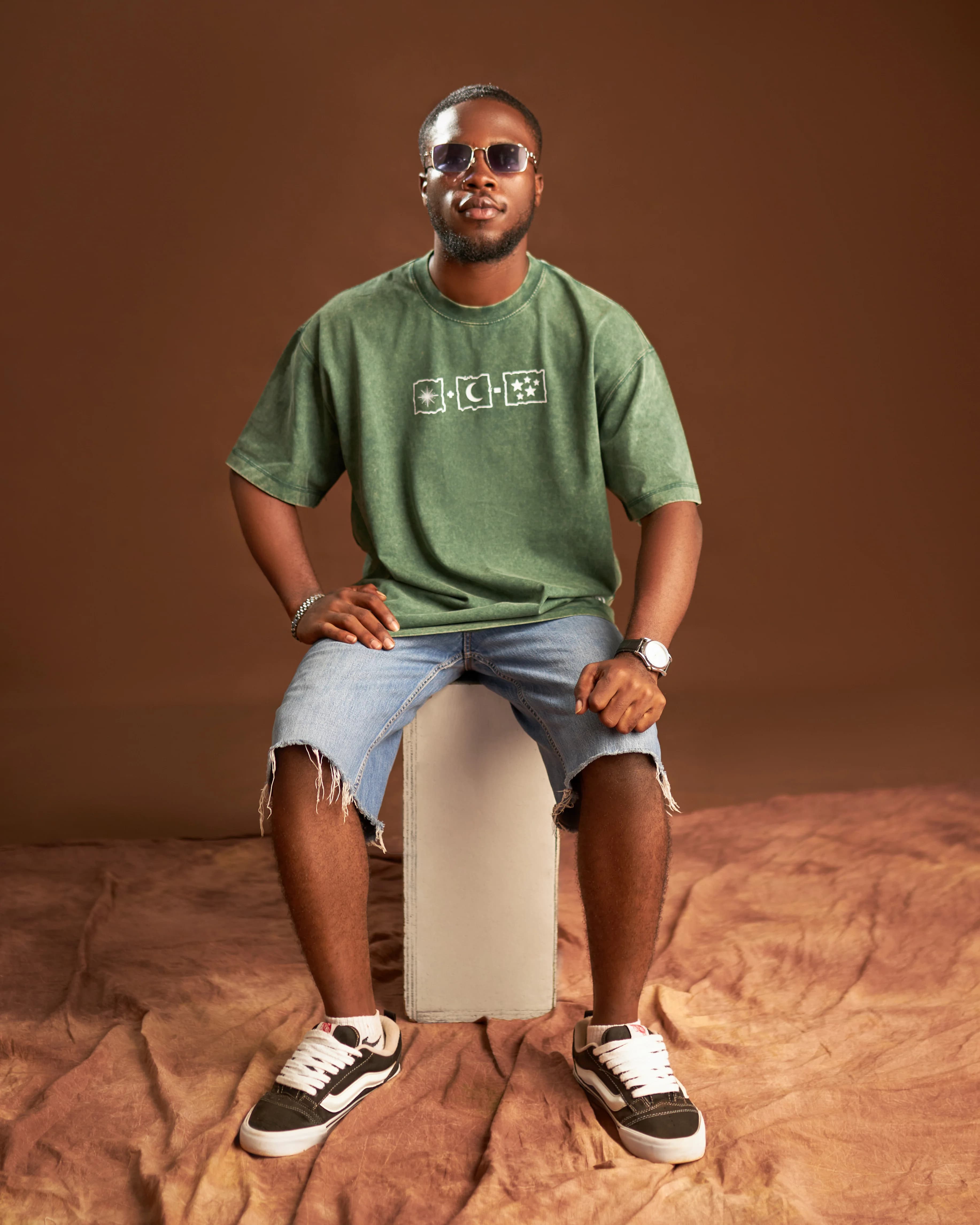 Kairova 224 Olive Tee, Seated Studio Shoot