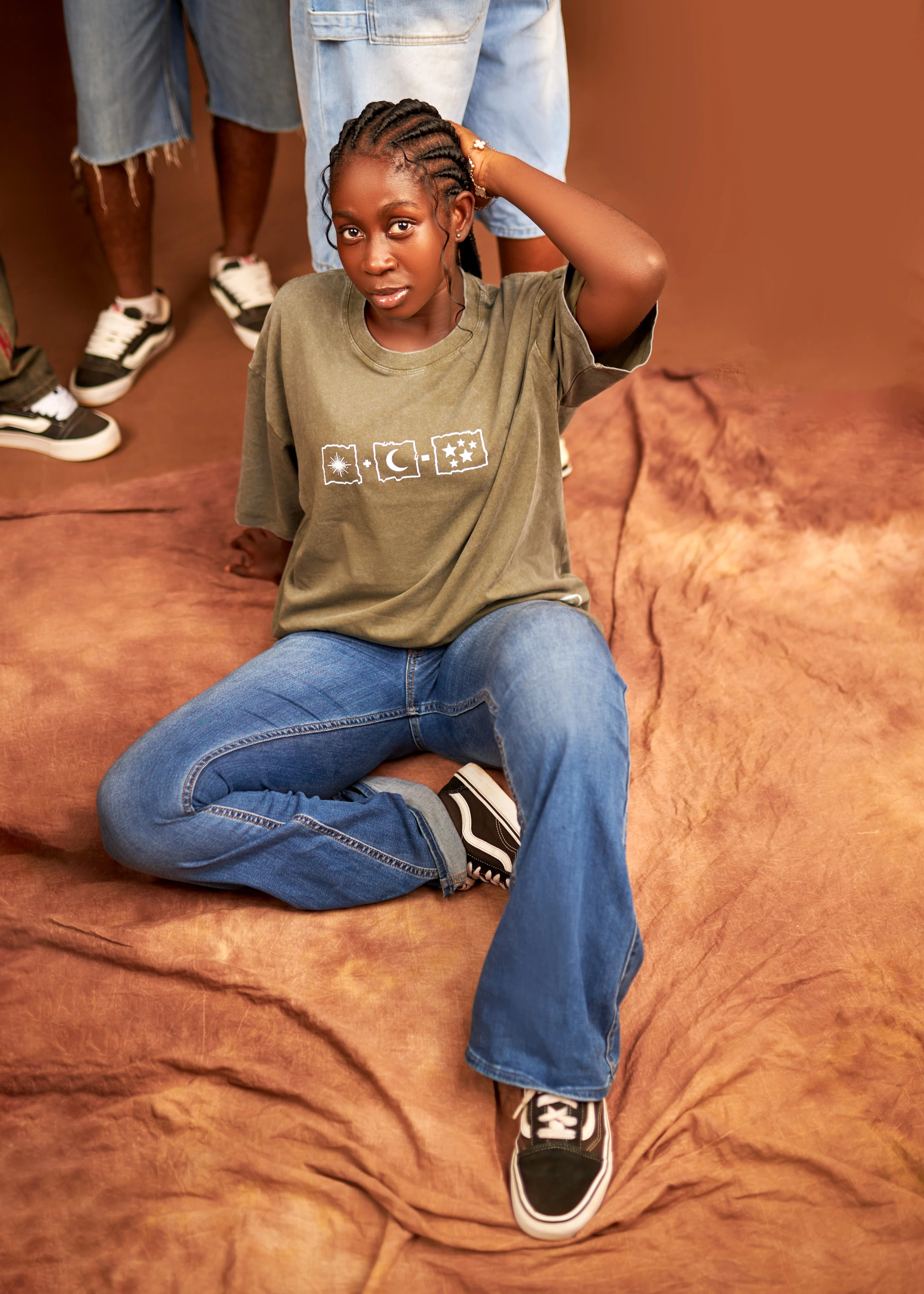 Kairova 224 Sand Tee, Seated Studio Editorial